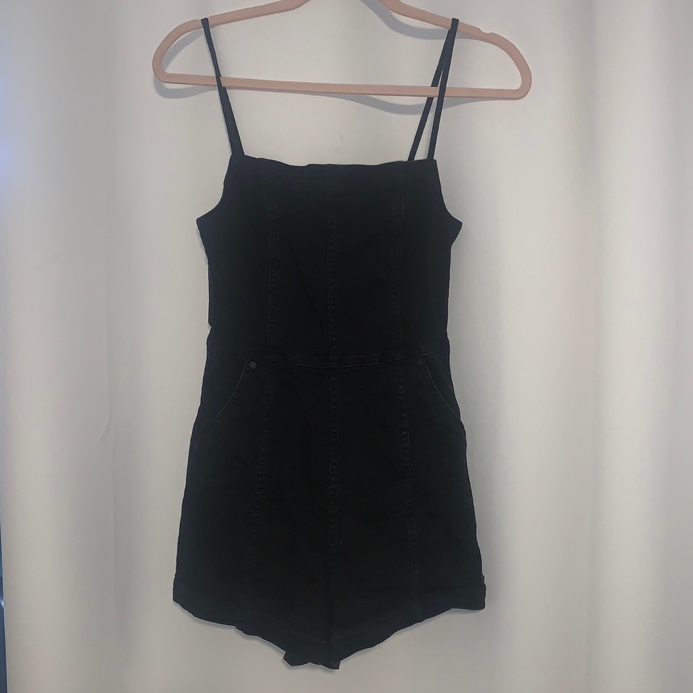 Black jean Volcom romper.